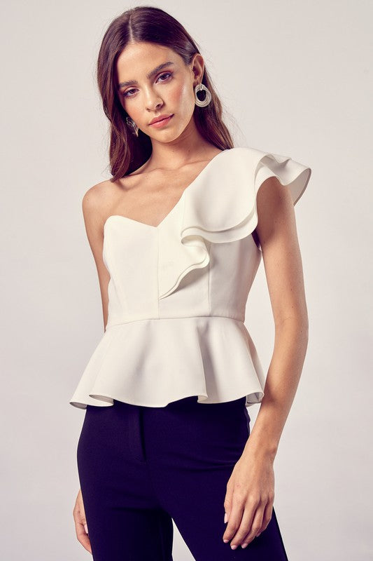 Top peplum con volante y un hombro