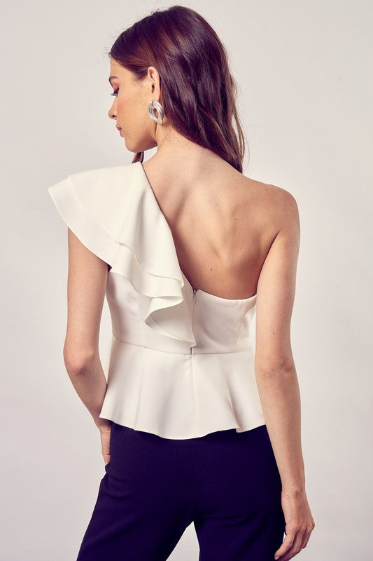 Top peplum con volante y un hombro