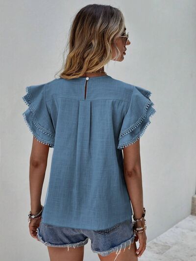 Blouse à col rond et manches courtes à volants