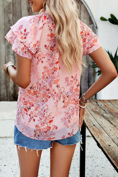 Blusa estampada con cuello simulado y volantes