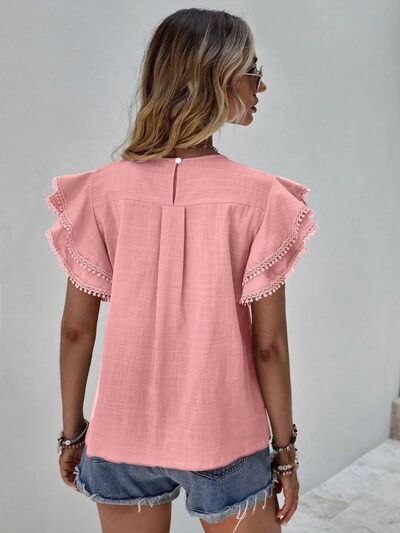 Blouse à col rond et manches courtes à volants